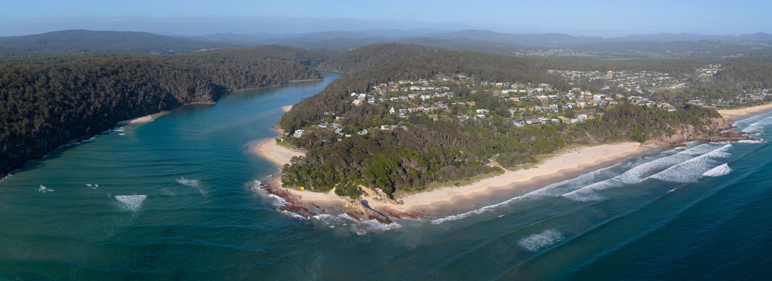 Aerial view of a river and town on the NSW South Coast